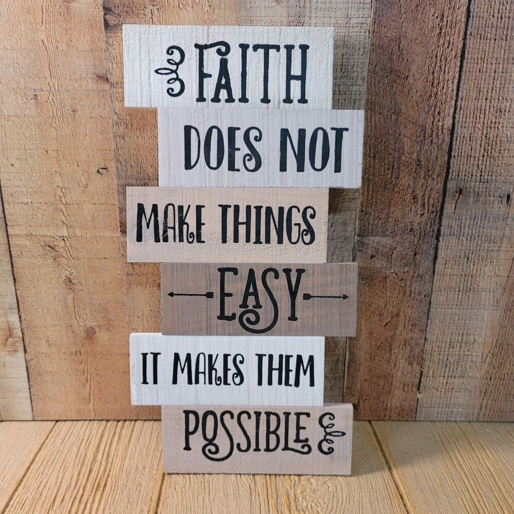 Wood sign that states Faith does not make things Easy, it makes them possible.